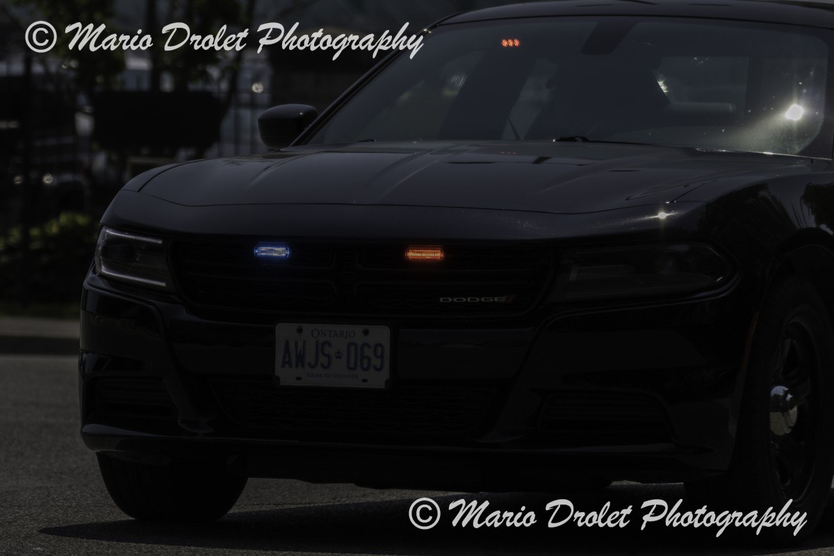 Police Escort Closing the Canada Day Parade Celebration in Port Credit, Ontario, Canada