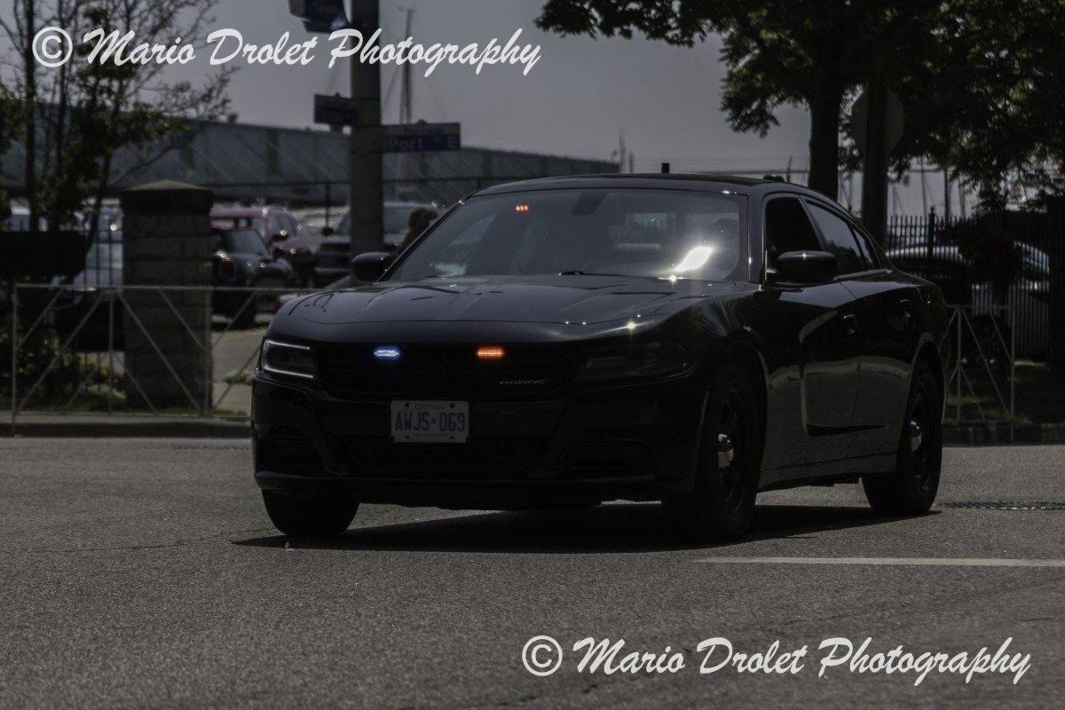 Police Escort Closing the Canada Day Parade Celebration in Port Credit, Ontario, Canada