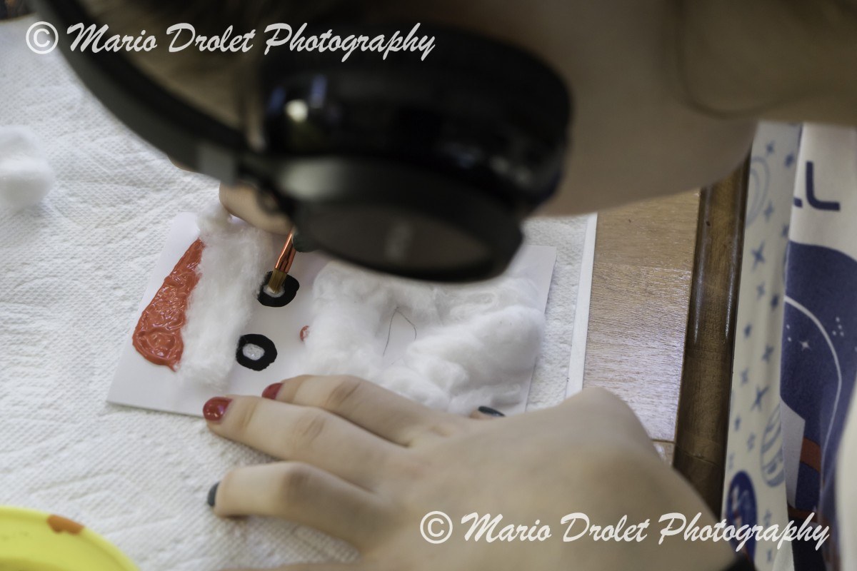 Colour photo of a person making christmas cards