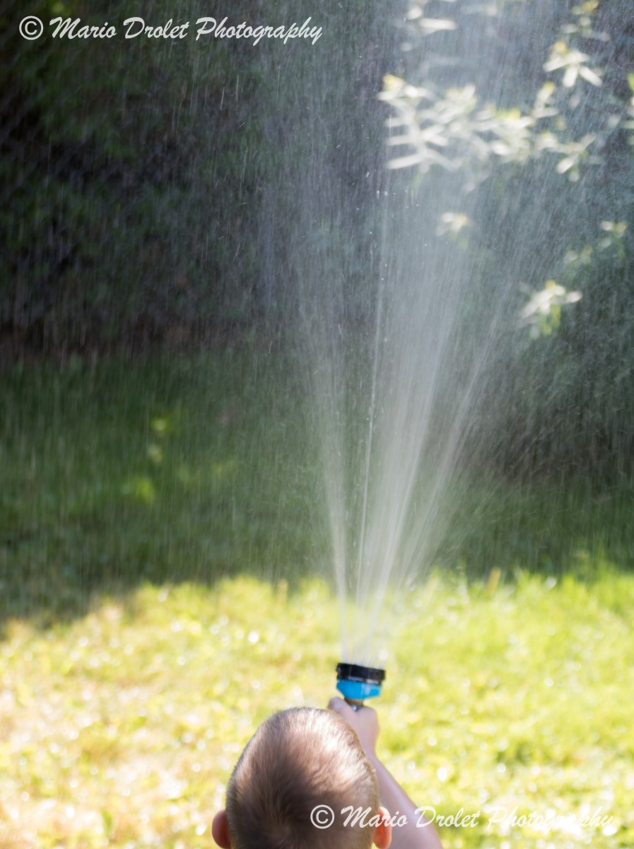 Playing with Water on a Hot Summer Day
