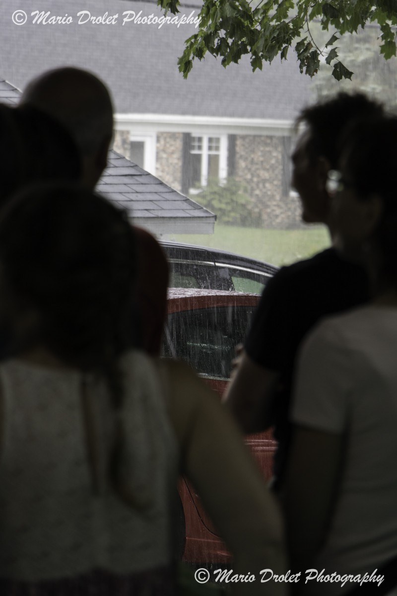 Colour photo of rain falling on a car