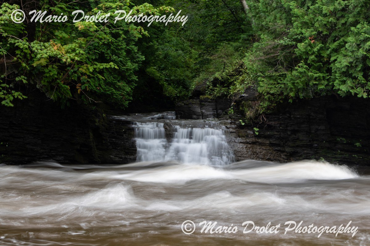 Small waterfall and St. Charles creek in Parc Chauveau using long exposure
