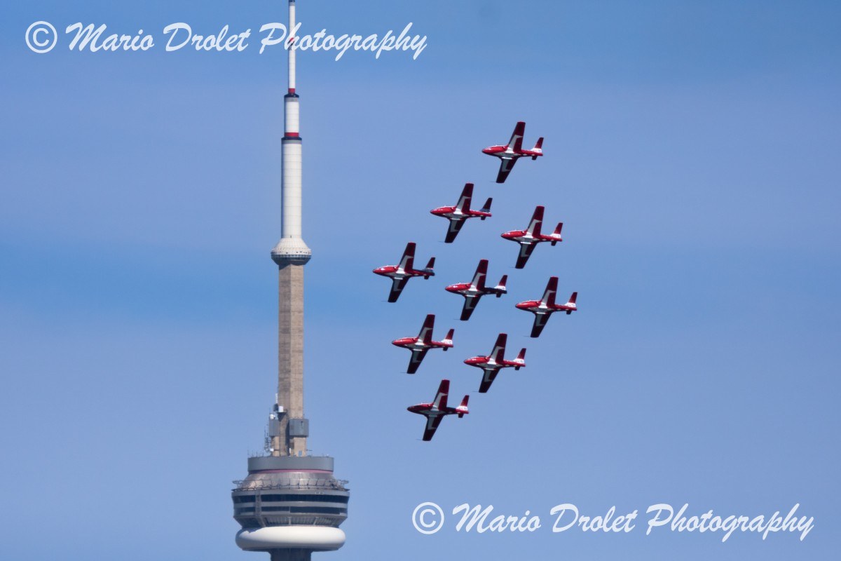 Canadian Snowbird flying around the CN Tower during the CNE Air Show